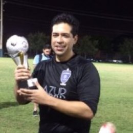 Former soccer goalie ends up in software development and earns spot in LHS Hall of Fame Marc Raygoza with his soccer trophy.