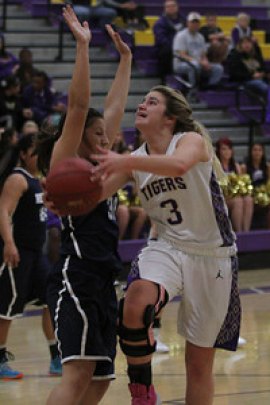 Kayla Beck goes for two points against Redwood High School.