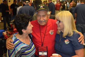 Fresno's John Salas, Sandy Salyer right, and Salas' daughter prepare for their departure on an Honor Flight to see the World War II Memorial.