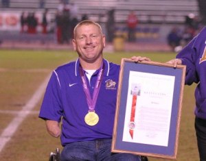Jeff Fabry at Lemoore High School football game accepting proclamation.