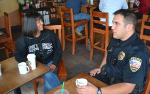 Locals share a cup of coffee with Lemoore Police Officers in department outreach Rosie Madrigal chats with Lemoore Police Department Officer Jon Giles.