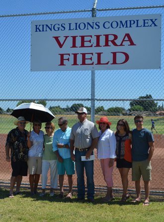 Members of the Vieira family and relatives of John Patrick Vieira gather for a rededication of the softball field named after him.