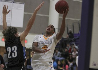 Tigers basketball teams gear up for runs at West Yosemite League championships Allen Perryman looks to score against Clovis North on Tuesday night in the LHS Event Center.