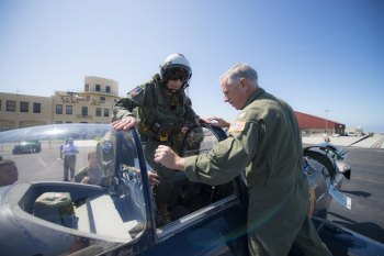 Retired Cmdr. Dean "Diz" Laird walks into the rear seat of a T-34C Turbomentor with the "Flying Eagles" of Strike Fighter Squadron VFA 122. 