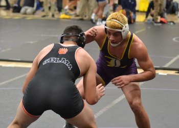 Angel Solis, shown here in an earlier bout at Saturday's Masters in Lemoore, lost in the semis but earned a trip to the state championships March 4-5 in Bakersfield.