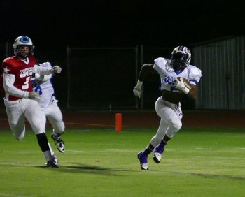 Tiger contingent not enough to beat East in Tulare-Kings All Star tilt Marquis Love hauls in a pass from Tiger quarterback Cort Groathouse.