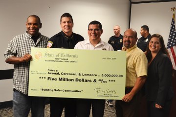 Lemoore's dream of new police dispatch center one more step toward fruition Left to right: Councilmember Eddie Neal, Chief Darrel Smith, Assemblymember Rudy Salas, Councilmember Ray Madrigal and City Manager Andi Welsh pose with a $5 million check presented to the cities of Avenal, Corcoran and Lemoore.