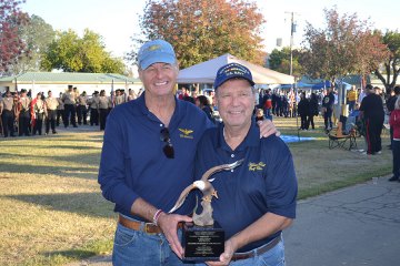 Jim Lloyd, the aviator Harry Zinser (right) saved 43 years ago, is pictured with the Navy Captain.