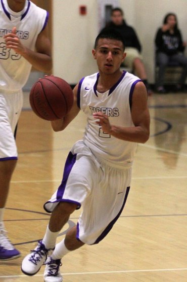 Erick Perry eyes the basket in game against West.