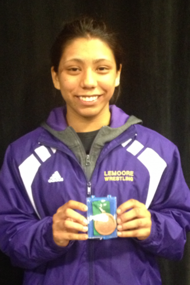 Esperanza Cadena with her sixth place state wrestling medal.