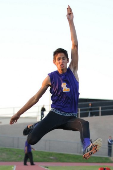 Michael Burke finished fourth in the high jump. He's shown here is the triple jump from last year.