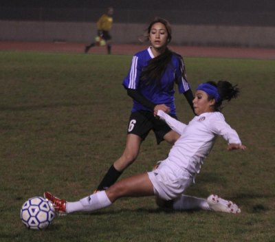Cassie Sandoval eyes the ball in Hanford West win.