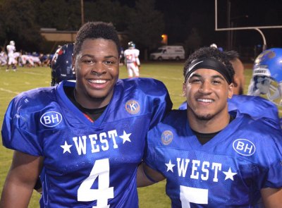 ReShaun Davis and Richard Doctor share a moment after Friday night's victory over the East.