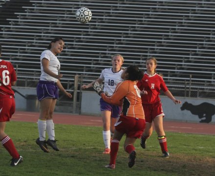 Lemoore freshman Taylor Paramo gets a header into the net as the junior varsity beat Hanford 5-1.