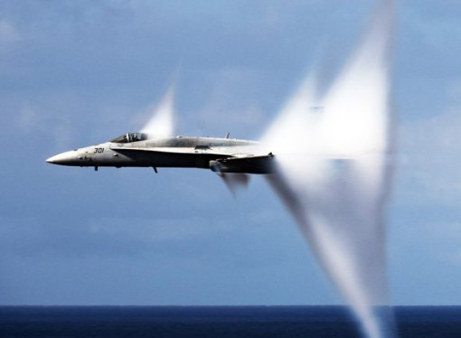 Stock photo of jet breaking sound barrier.