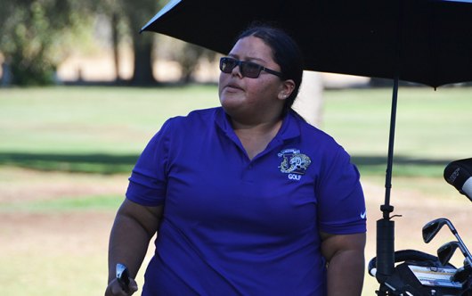 Lemoore's Aiyana Barrios checks out her shot on the Par 5 ninth hole Tuesday at the Lemoore Golf Course. She finished third overall with an 86.