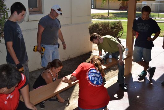Lemoore High students help replace benches as part of a Lowe's community project on Saturday, Sept. 21.