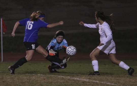 Lady Tigers' soccer beats West to hold on to second in West Yosemite League Kaity Sweet makes a save during Friday's win over Hanford West.