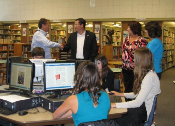 Assemblymember Rudy Salas greets library staff and Principal Rodney Brumit and Superintendent Debbie Muro during a visit Thursday.