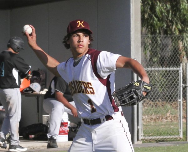 Crusader Mason Munoz picks off a runner headed for first.