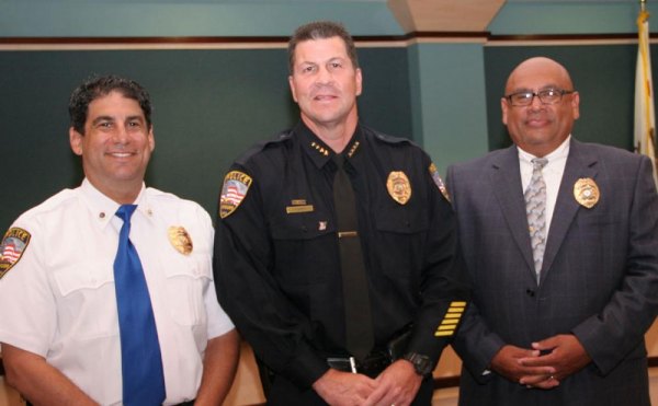 Lemoore Chief Darrell Smith welcomes new chaplains Dave Droker (left) and Robert Flores (right) to the police department.