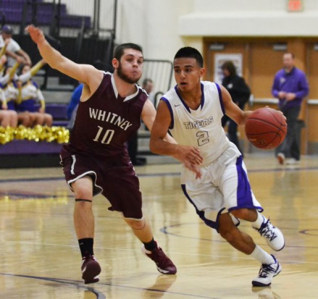 Erick Perry in an earlier game versus Mt. Whitney. He had a pair of three pointers in the final minutes to lead Lemoore.