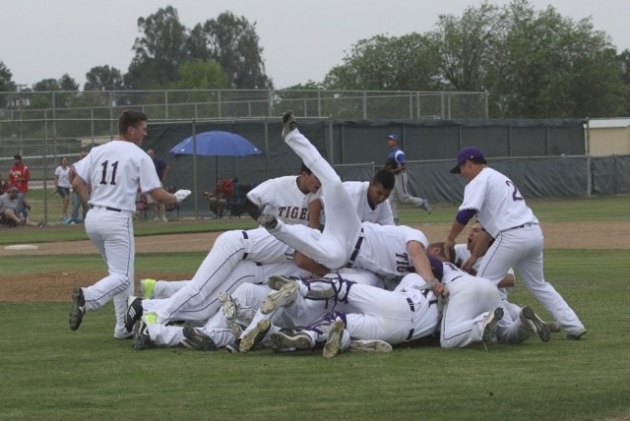 Lemoore's varsity boys' baseball team celebrates after coming from behind to defeat Hanford West.