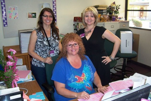 Lemoore's Teacher of the Year Margaret Doyle, Classified Employee, Denise Calhoun (sitting) and Administrator of the Year Jamie Rogers.