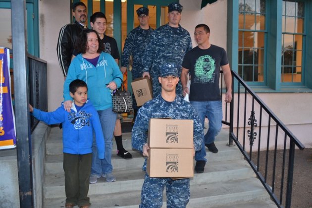 NAS Lemoore Seabees help with gifts.