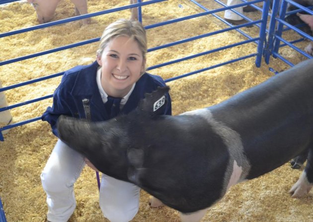 Lemoore FFA member Kelsie Cotta and her pig Stella at the 2014 Kings County Fair.